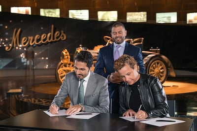 Muhammad BinGhatti, chief executive, Binghatti Properties and Britta Seeger, member of the board of management of Mercedes-Benz Group AG, Marketing & Sales, sign the partnership agreement. 