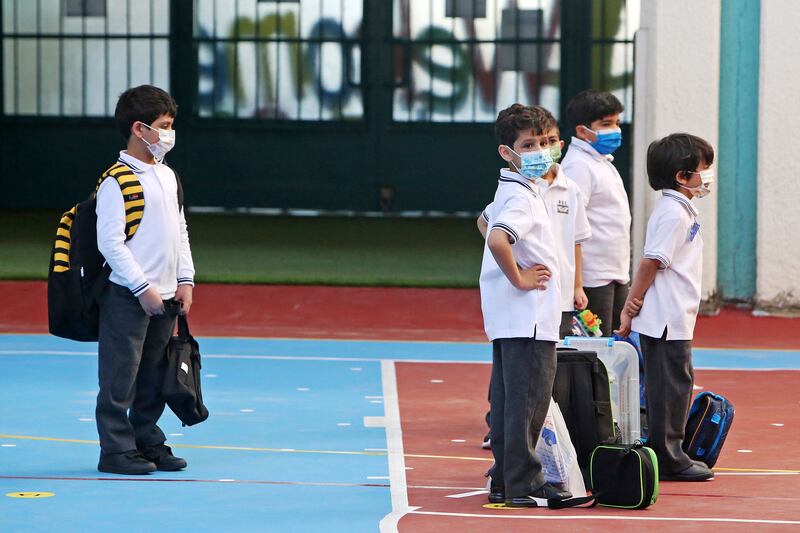 Young pupils on their first day back to school for in-person classes in Kuwait City.
