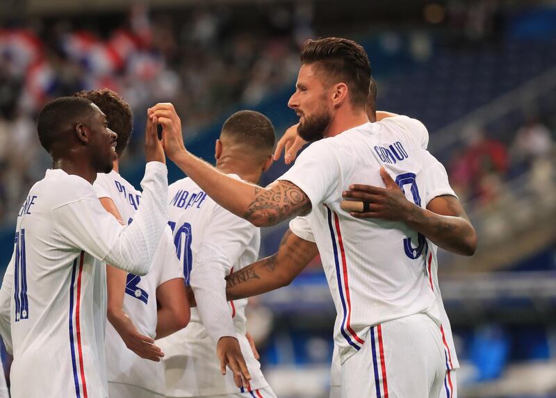 Olivier Giroud celebrates with his teammates after scoring for France during the International friendly against Bulgaria in Saint Denis, near Paris. EPA
