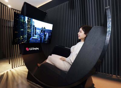 The Media Chair is a modern relaxation device combining a 55-inch OLED TV display with a comfortable recliner. Photo: LG Display