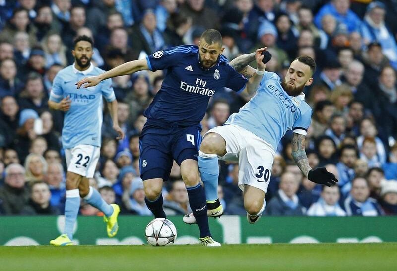 Real Madrid’s Karim Benzema in action with Manchester City’s Nicolas Otamendi. Darren Staples / Reuters