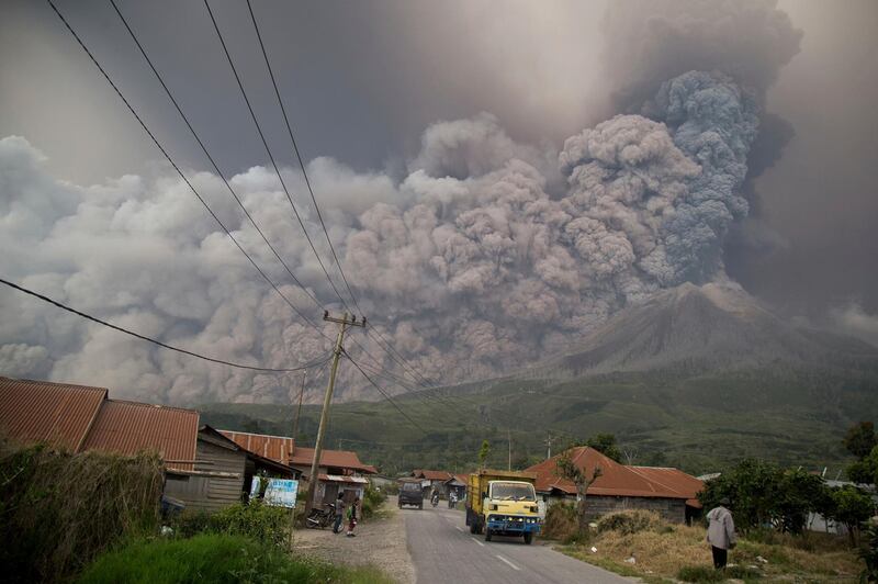 Mount Sinabung spews volcanic ash as it erupts in Kutarakyat, North Sumatra, Indonesia. Endro Rusharyanto / AP Photo