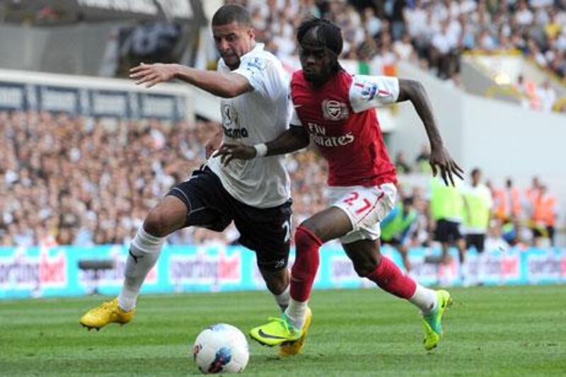 Tottenham Hotspur's Kyle Walker, left, spent much of the day defending the Spurs' goal against Yao Gervinho and other Arsenal threats before finding his way forward to score the game-winner.