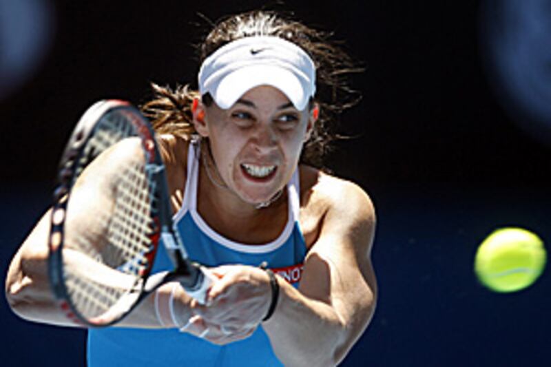 Marion Bartoli makes a return on her way to defeating Serbia's Jelena Jankovic.