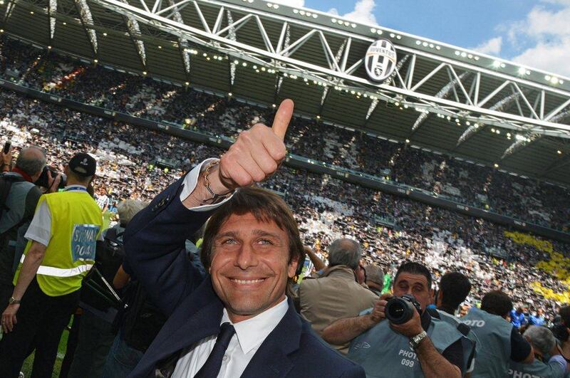 Antonio Conte clashes a thumbs up to the crowd at Juventus Stadium before their match against Cagliari on May 18, 2014. Andrea Di Marco / EPA