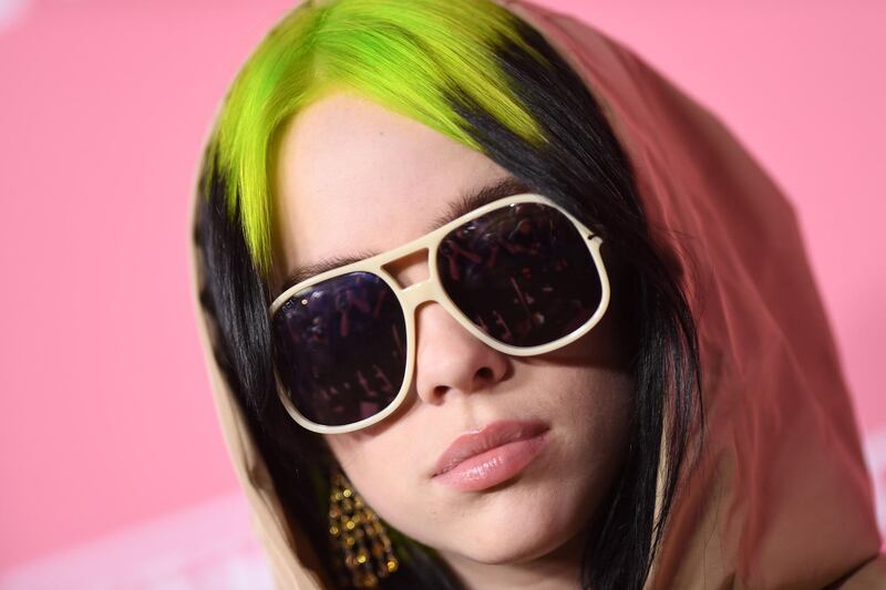 (FILES) In this file photo taken on December 12, 2019 US singer/songwriter honoree Billie Eilish arrives for Billboard's 2019 Woman of the Year at the Holllywood Palladium in Los Angeles. Los Angeles is gearing up for the Grammys, music's marquee night, with Lizzo, Billie Eilish and Lil Nas X leading a pack of young, talented contenders hoping to strike gold on Sunday. But revelations of infighting at the Recording Academy, which organizes the awards show, and an explosive allegation of rape has cast a dark shadow over the glitzy gala and rattled the institution's efforts to shed its out-of-touch image.
 / AFP / VALERIE MACON
