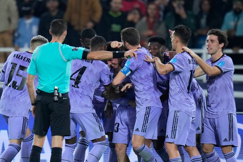 Real's Sergio Arribas celebrates with teammates after scoring his side's fourth goal. AP