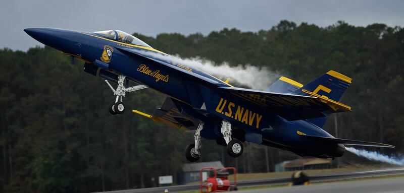 US Navy Blue Angel No. 5, flown by Commander Ben Walborn, takes off during practice in Rome, Georgia. AP