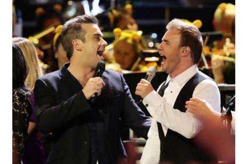 Robbie Williams will be reuniting with Gary Barlow, right, and the other members of Take That for a new album to be released later this year. Williams left the popular boy band in 1995.