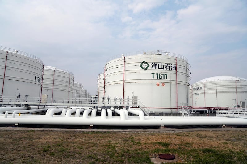 FILE PHOTO: Oil tanks are seen at an oil warehouse at Yangshan port in Shanghai, China March 14, 2018. REUTERS/Aly Song/File Photo