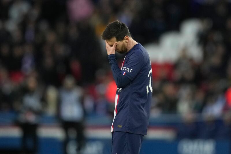PSG's Lionel Messi touches his forehead in the final minutes as his side head for a 2-0 home defeat against Stade Rennes. AP