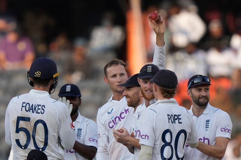 England's Tom Hartley raises the ball as he celebrates his five-wicket haul. AP