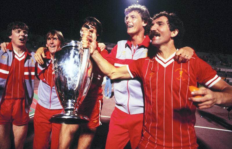 ROME, ITALY - MAY 30:  (From left to right) Liverpool players Steve Nicol, Kenny Dalglish, Alan Hansen (obscured), Gary Gillespie, and captain Greaeme Souness celebrate with the trophy after winning the UEFA European Cup Final between AS Roma and Liverpool FC held on May 30, 1984 at the Stadio Olimpico in Rome, Italy. The match ended in a 1-1 after extra-time, with Liverpool winning the match and trophy 4-2 on Penalties. (Photo by Liverpool FC/Liverpool FC via Getty Images)