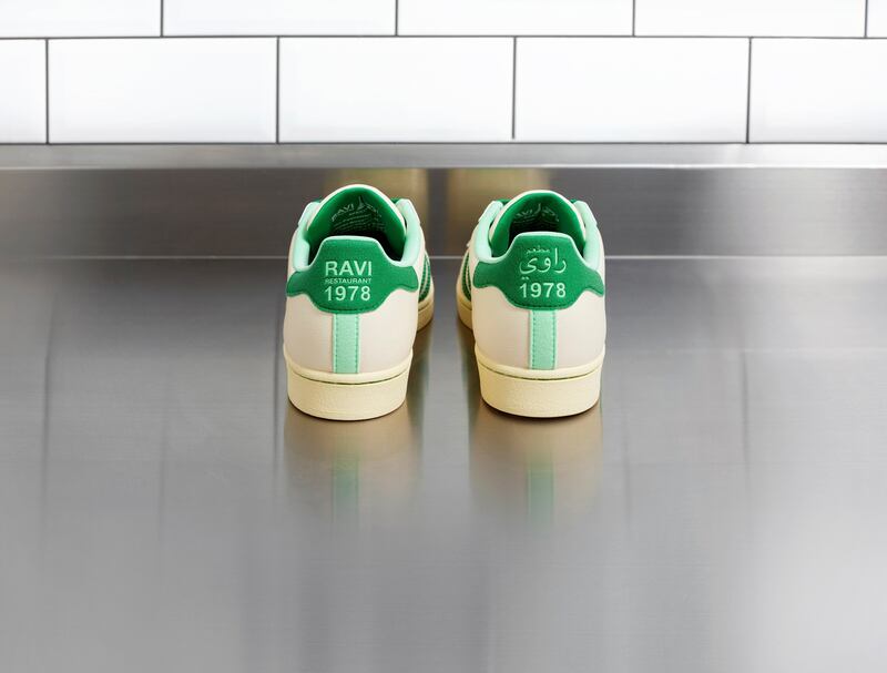 The adidas Original Superstar trainers have the Ravi name as well as the year the restaurant opened embroidered on the heel tab.