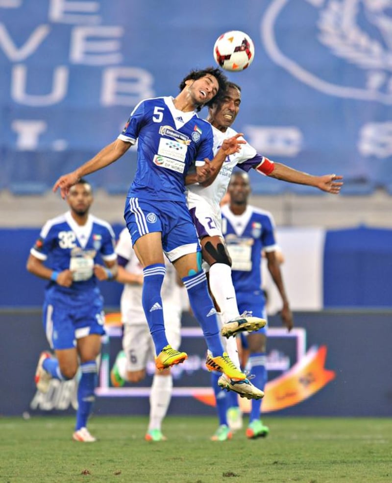 Tariq Ahmed, left, and his Al Nasr teammates were a head above Helal Saeed and Al Ain. Ibrahima Toure's goal was the difference in Nasr's 1-0 win at Al Maktoum Stadium in Oud Metha, Dubai City, Dubai, on February 21, 2014. Jeff Topping/ For The National