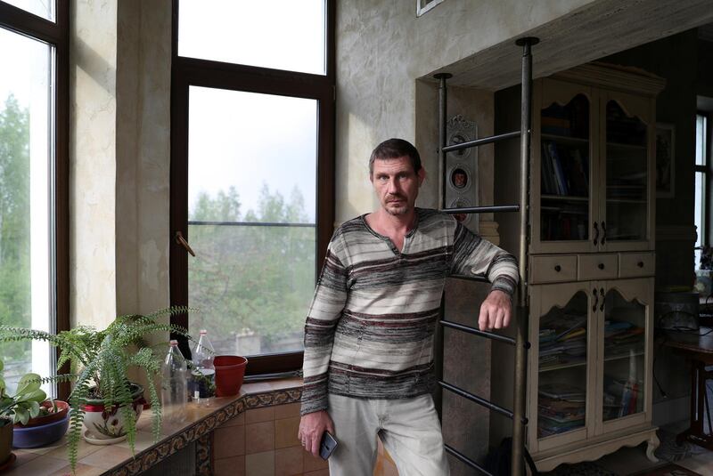 Entrepreneur Dmitry Bocharov poses for a picture in his house outside Moscow, Russia May 14, 2020. Bocharov, 46, is the owner of four hair salons, which closed their doors at the end of March due to lockdown measures amid the outbreak of the coronavirus disease (COVID-19). REUTERS/Evgenia Novozhenina