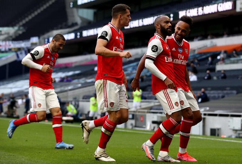 Alexandre Lacazette celebrates the opening goal with teammates. PA