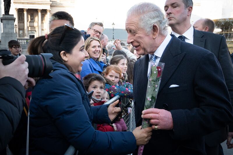 He is given a rose for Valentine's Day. AFP