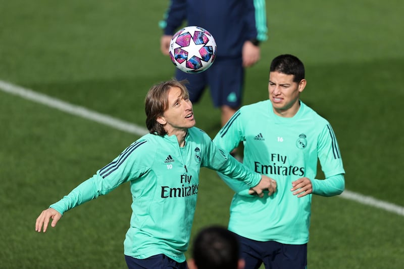 Luka Modric and James Rodriguez compete for the ball during  training session in Madrid. Getty