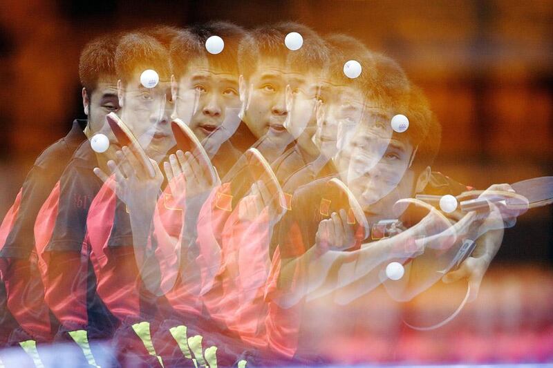 LONDON, ENGLAND - SEPTEMBER 08:  (EDITORS NOTE: Multiple exposures were combined in camera to produce this image.) Lin Ma of China serves against Patryk Chojnowski of Poland during the final of the Men's Team Table Tennis - Class 9-10 on day 10 of the London 2012 Paralympic Games at ExCel on September 8, 2012 in London, England.  (Photo by Matthew Lloyd/Getty Images)