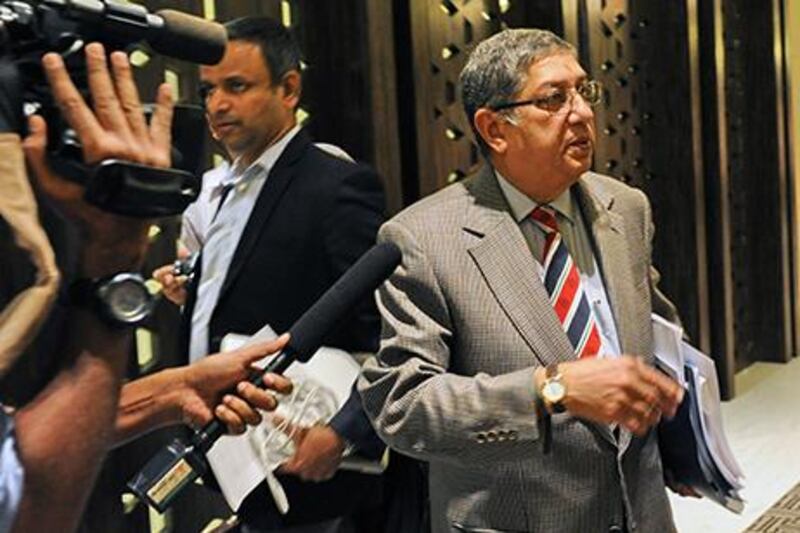 N Srinivasan, right, has been asked to step aside by India's Supreme Court until pending investigation into corruption allegations. Roslan Rahman / AFP