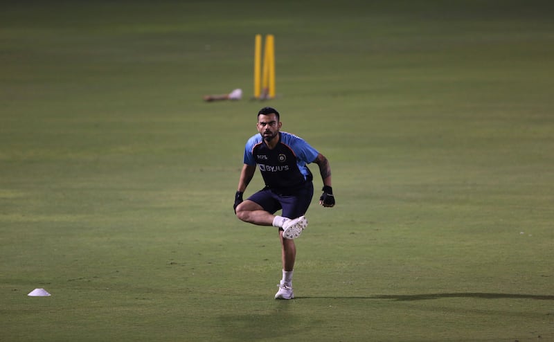 Indian cricket captain Virat Kohli, warms up during a training session a day ahead of their match against Pakistan. AP