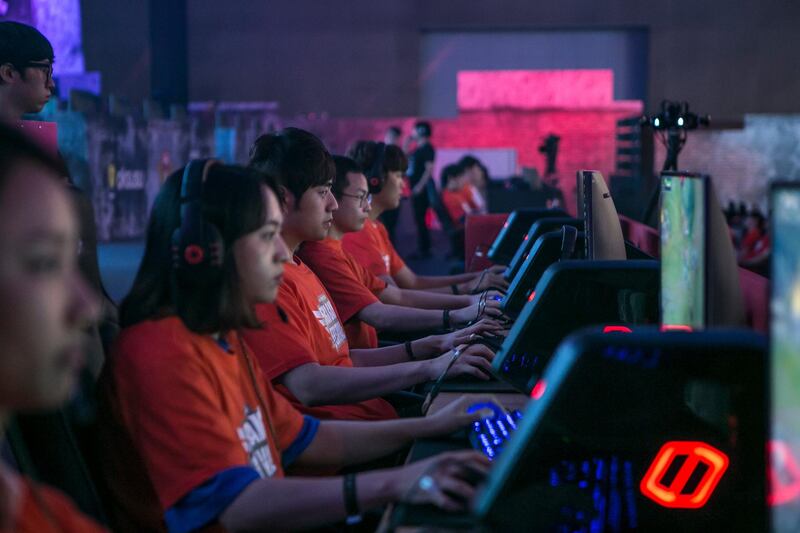 Gamers of the SK Telecom professional video-game team, sponsored by SK Telecom Co., play the League of Legends game during a tournament at the 5GX Game Festival in Goyang, South Korea, on Friday, Aug. 10, 2018. Professional video gaming began in South Korea more than a decade ago, and has given rise to leagues that now pack stadiums and draw hundreds of thousands of eyeballs to Twitch livestreams for tournaments. Photographer: Jean Chung/Bloomberg