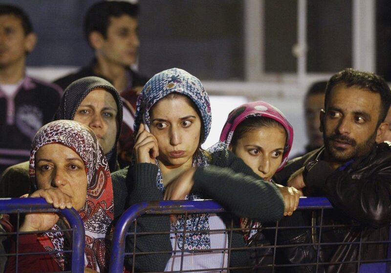 Relatives of miners who are trapped in a coal mine wait in front of a hospital in Soma. Osman Orsal / Reuters