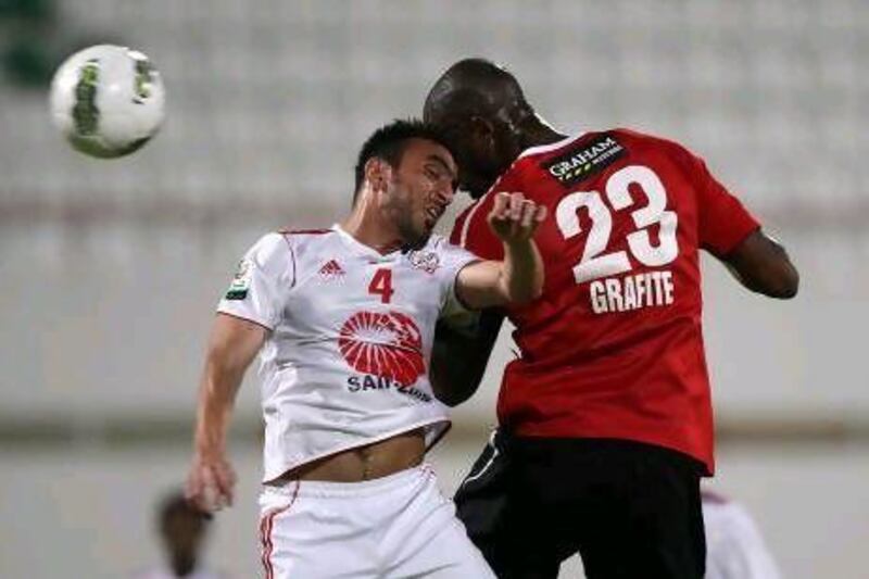Grafite, in red, scored twice for Al Ahli to leave Sharjah staring relegation in the face. Pawan Singh / The National