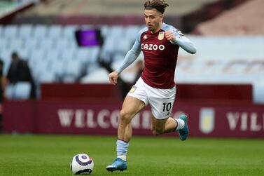 (FILES) In this file photo taken on May 13, 2021 Aston Villa's English midfielder Jack Grealish runs with the ball during the English Premier League football match between Aston Villa and Everton at Villa Park in Birmingham, central England.  - Manchester City are on the verge of signing Aston Villa playmaker Jack Grealish in a British record £100 million ($139 million) deal, according to reports on August 4, 2021.  (Photo by CARL RECINE / POOL / AFP) / RESTRICTED TO EDITORIAL USE.  No use with unauthorized audio, video, data, fixture lists, club/league logos or 'live' services.  Online in-match use limited to 120 images.  An additional 40 images may be used in extra time.  No video emulation.  Social media in-match use limited to 120 images.  An additional 40 images may be used in extra time.  No use in betting publications, games or single club/league/player publications.   /  