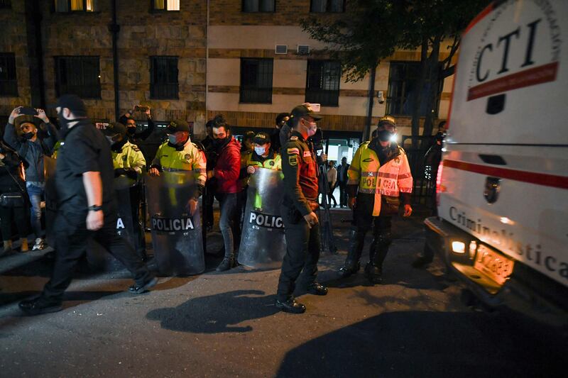 Police officers in front of the hotel where Hawkins died on March 25, 2022. AFP