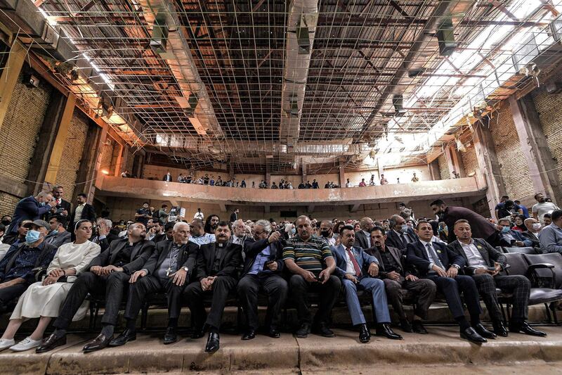 Syriac Catholic Archbishop of Mosul Youhanna Boutros Moshe, fourth from left, with other Christian clergymen and a Catholic nun at the performance by the Watar orchestral ensemble. AFP