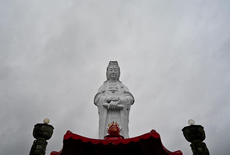 A statue of Matsu is seen at Zhongzheng park in Keelung city as typhoon Mitag approaches the northeast coast of Taiwan. AFP