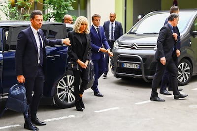 France's President Emmanuel Macron arrives at the University hospital (CHU) in Grenoble, in the French Alps, to visit the victims of a knife attack with his wife Brigitte Macron. AFP