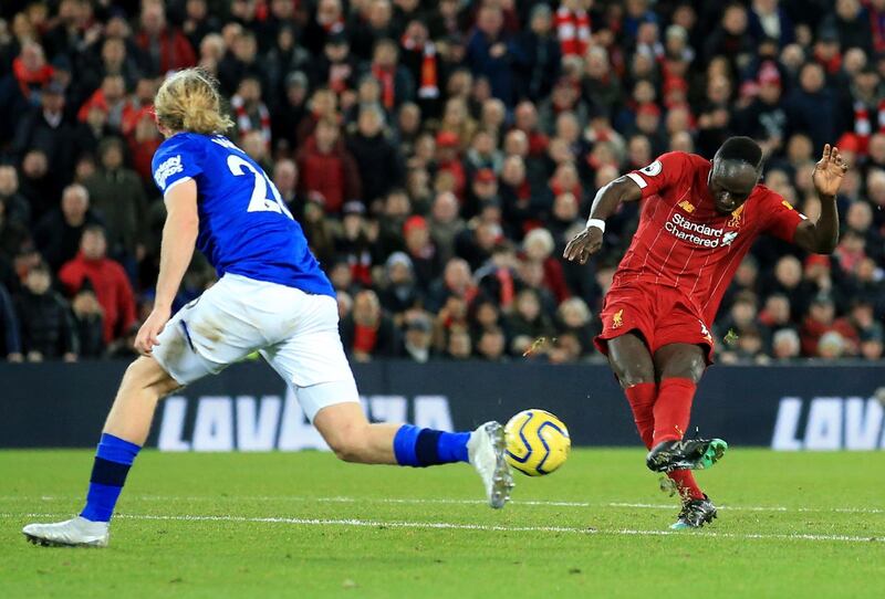 Liverpool's Sadio Mane adds the fourth, still in the first half. AP