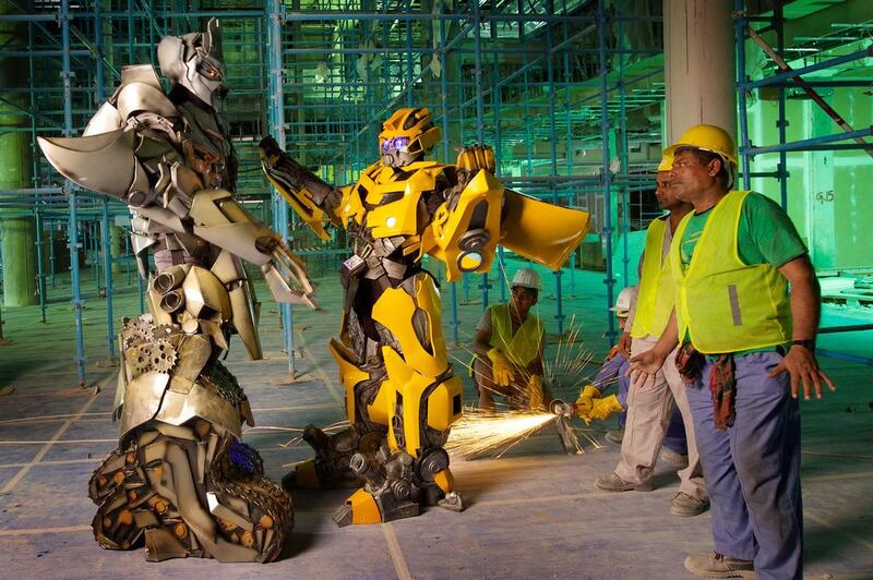 'Transformers' characters Megatron and Bumblebee surprise a construction team in BurJuman’s north wing during a break from performing at DSS's Decepticon Clone event. Photo: DFRE