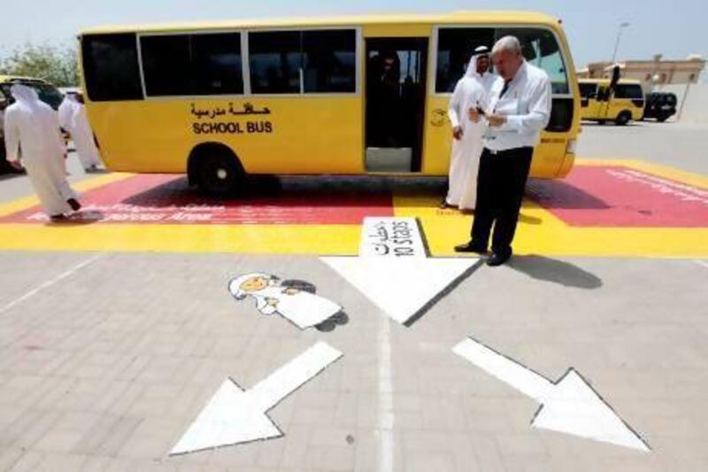 As part of the Golden Base programme that has been on display at the Al Qayim School in Barsha, the red zone means "very dangerous" while the yellow area is classified as "dangerous". Children are taught to take 10 steps away from the yellow zone as soon as the leave the bus. Jeffrey E Biteng / The National