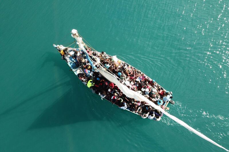 This aerial image shows a view of a ship with passengers from Port-de-Paix, the Haitian city hardest hit by a strong earthquake. Hector Retamal / AFP