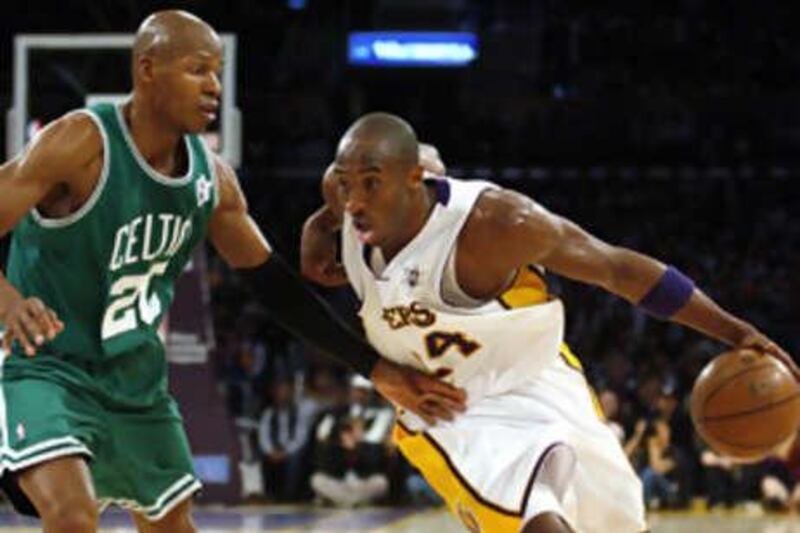 The Los Angeles Lakers' Kobe Bryant drives around the Celtics' Ray Allen during Thursday night's game. The Lakers came through in a thrilling fourth quarter to take victory.