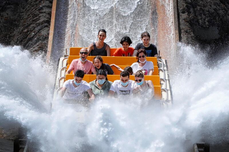 Visitors enjoy the Tutuki Splash ride in PortAventura World amusement park, in Tarragona, Spain. EPA