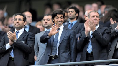 Manchester city owner Sheikh Mansour bin Zayed Al Nahyan (C) looks on during the English Premier League football match against Liverpool at The City of Manchester stadium, Manchester, north-west England on August 23, 2010. AFP PHOTO/ANDREW YATES.  FOR  EDITORIAL USE Additional licence required for any commercial/promotional use or use on TV or internet (except identical online version of newspaper) of Premier League/Football League photos. Tel DataCo +44 207 2981656. Do not alter/modify photo (Photo by ANDREW YATES / AFP)