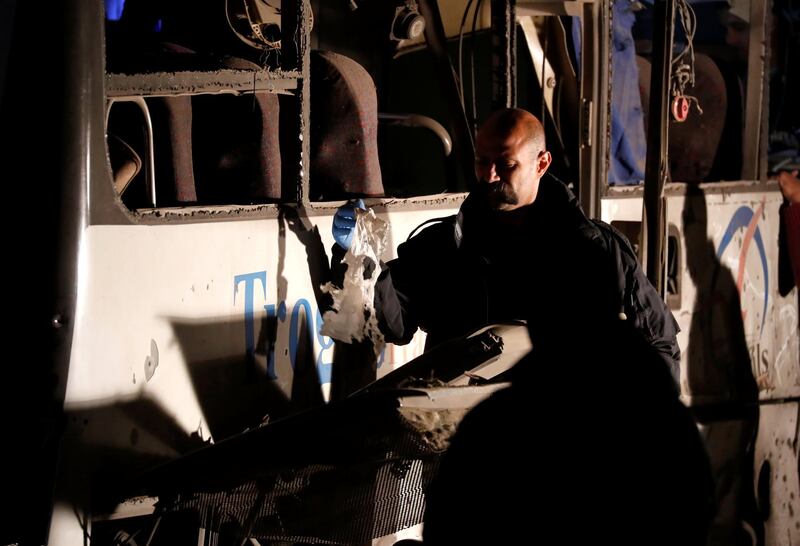 An official inspects the scene of the bus blast in Giza. Reuters