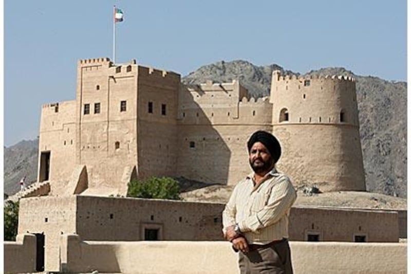 Amrik Plaha stands in front of the Fujairah fort he and his team have restored to its original condition.