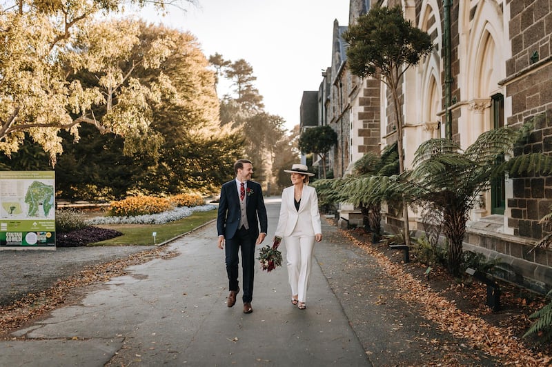 Sarah Holly, who eloped to New Zealand, wears a bespoke two-piece suit by UAE label House of Moirai. Stacey Cavalier Photography