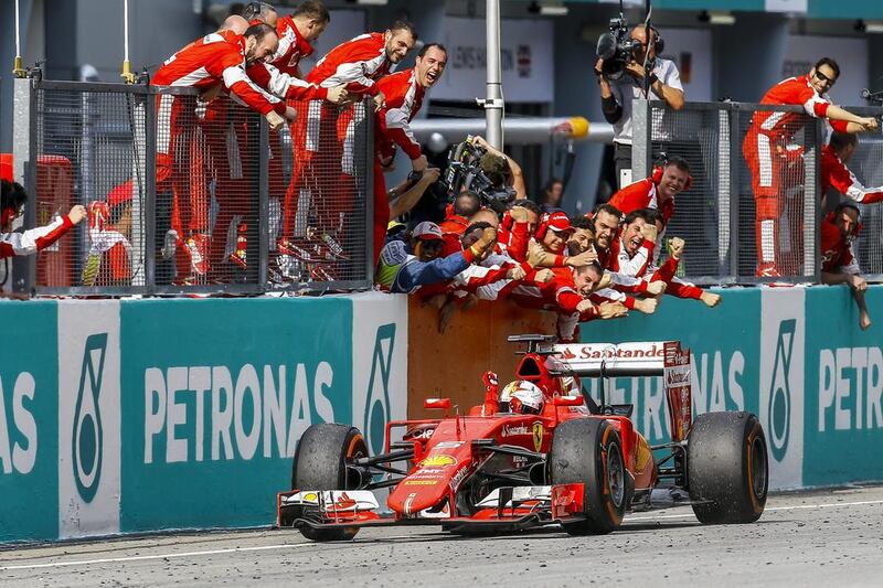 Vettel celebrates after winning the 2015 Formula One Grand Prix of Malaysia. Azhar Rahim / EPA