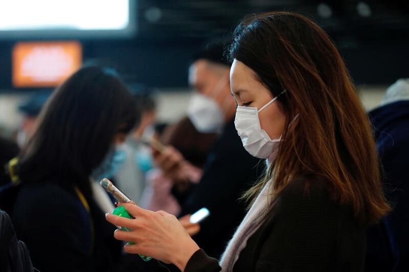 Passengers wear masks at the Hong Kong West Kowloon High Speed Train Station, in Hong Kong. Reuters