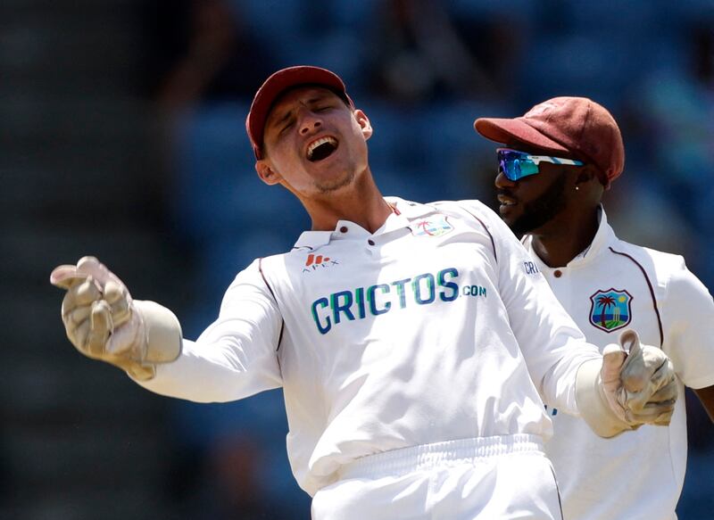 West Indies wiciketkeeper Joshua Da Silva celebrates taking the catch to dismiss England's Jack Leach for four. Reuters