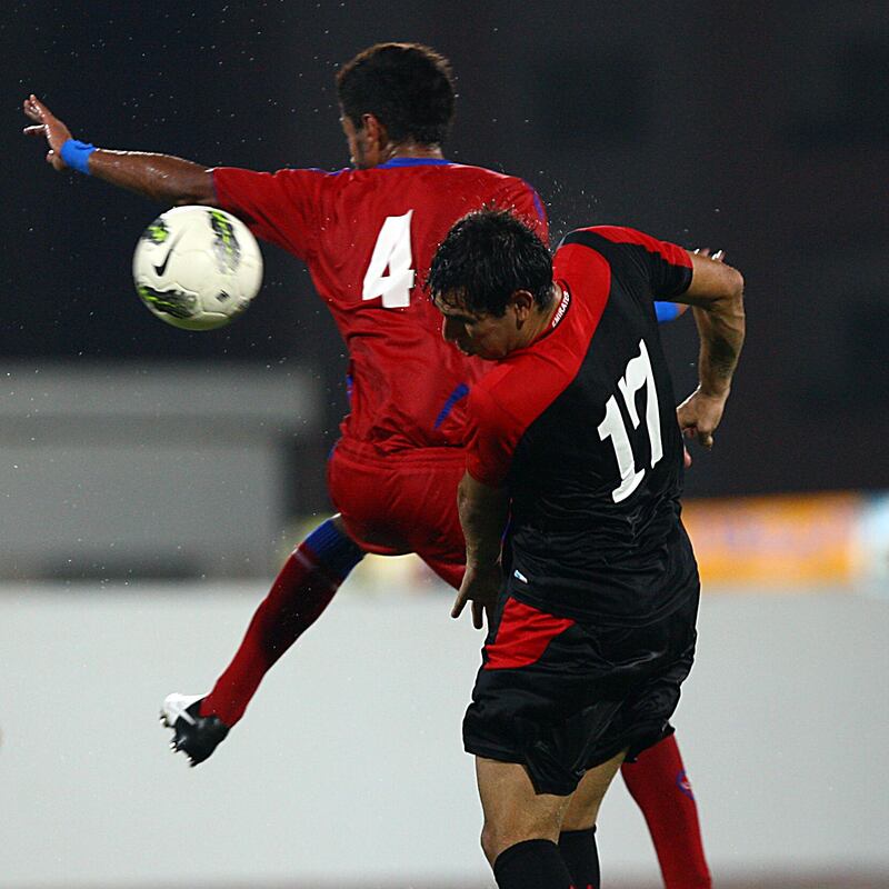 Ajman, United Arab Emirates-September  04, 2012;   Al Shaab (Red&Blue) and Emirate (Balck&Red) in action during the Pro League Round Robin tournament at the Ajman Football club in Ajman   . (  Satish Kumar / The National ) For Sports