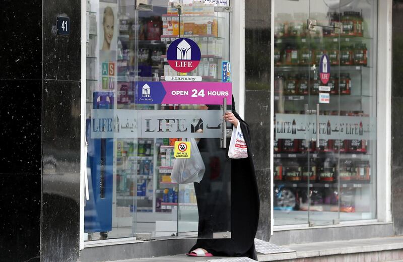 DUBAI, UNITED ARAB EMIRATES , April 11 – 2020 :- One of the customer at the LIFE Pharmacy in Deira Dubai. Dubai is conducting 24 hours sterilisation programme across all areas and communities in the Emirate and told residents to stay at home. UAE government told residents to wear face mask and gloves all the times outside the home whether they are showing symptoms of Covid-19 or not. (Pawan Singh/The National) For News/Online/Instagram/Standalone