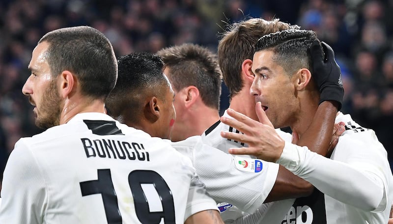 Cristiano Ronaldo celebrates with teammates after scoring Juventus' first goal. EPA